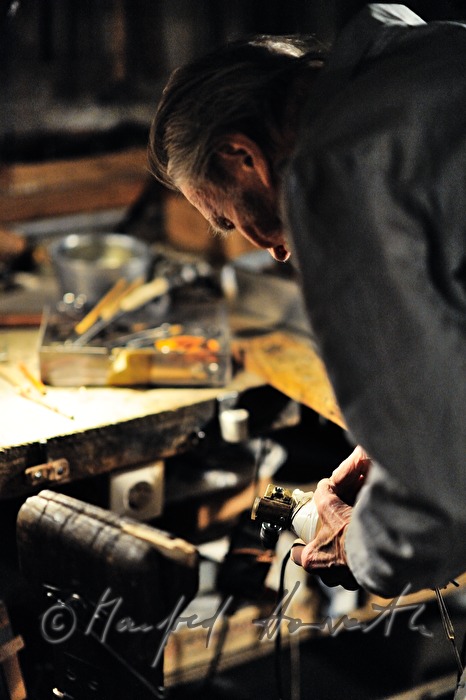 ship scale model maker Kurt Schaefer filing on the jaw vice