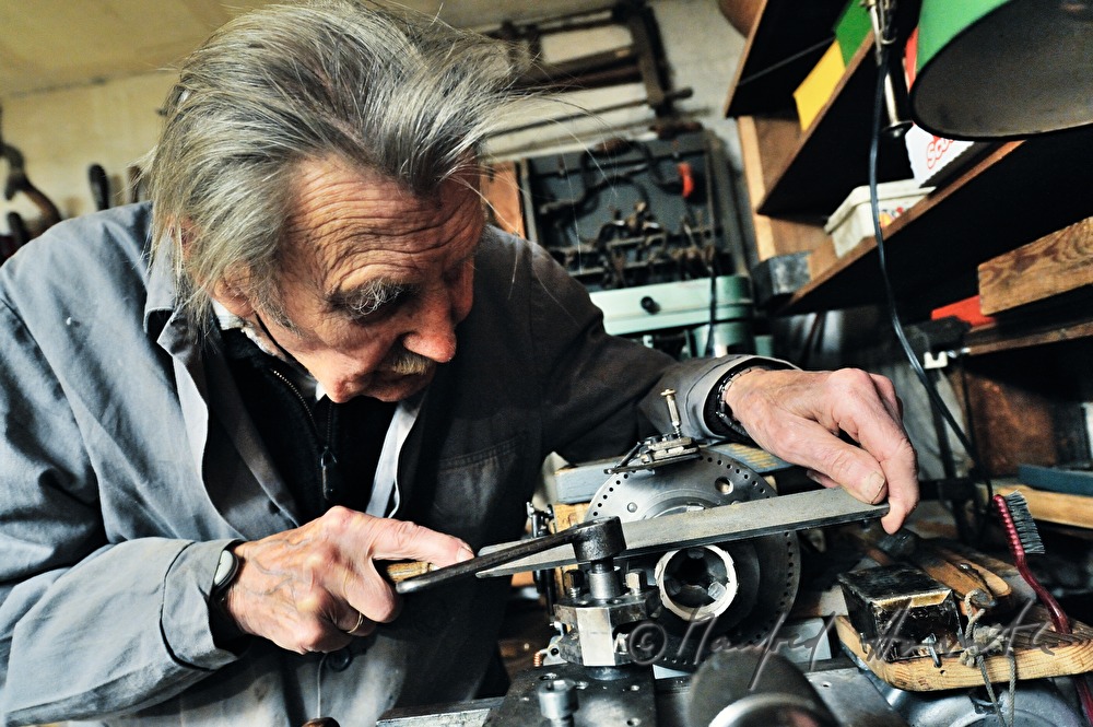 ship scale model maker Kurt Schaefer filing on the jaw vice