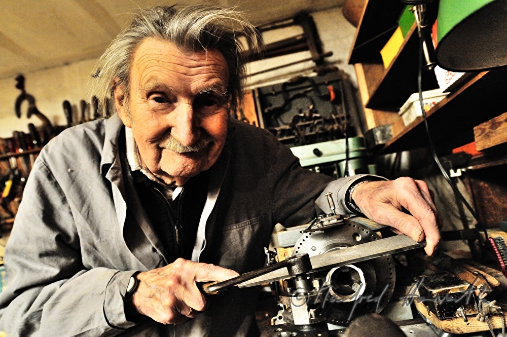 ship scale model maker Kurt Schaefer filing on the jaw vice