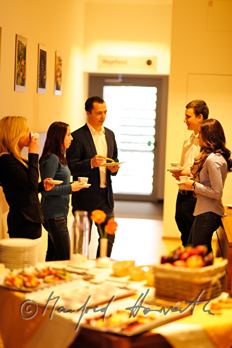 attendants of a seminar near the buffet