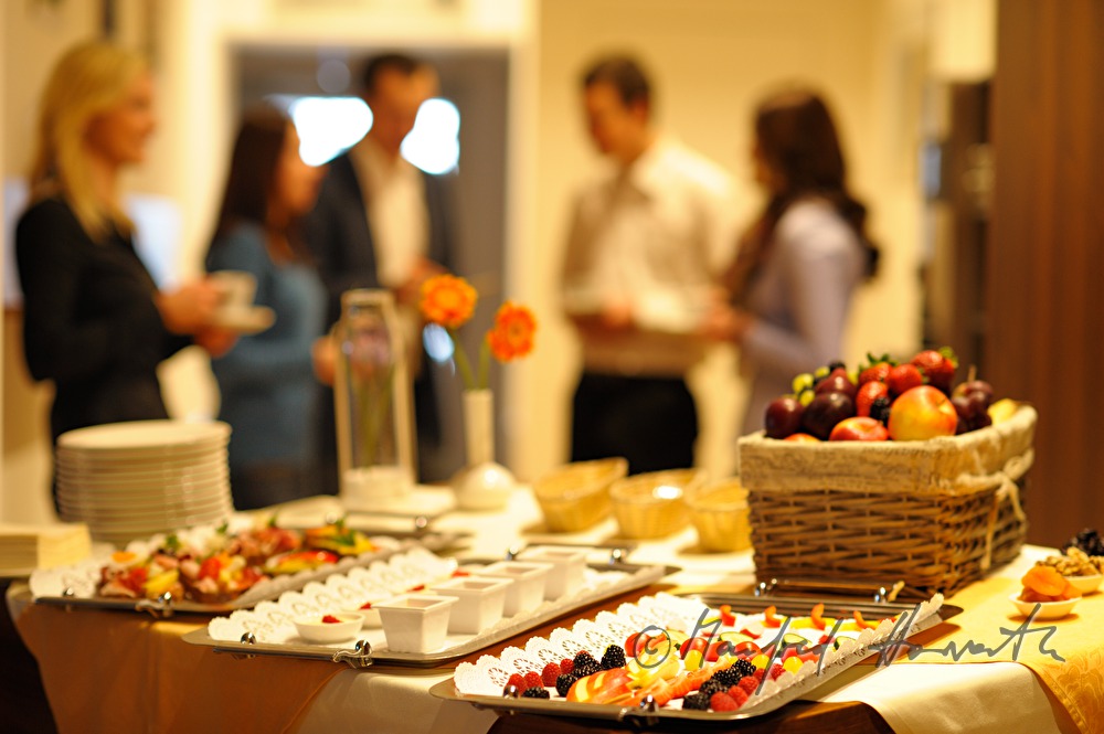 attendants of a seminar near the buffet