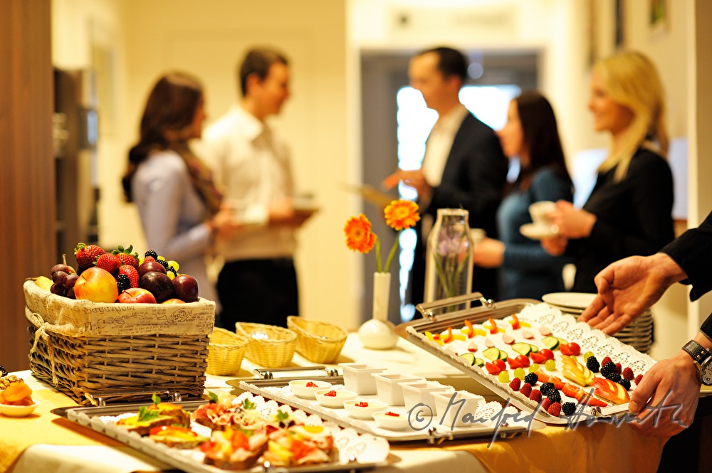 attendants of a seminar near the buffet