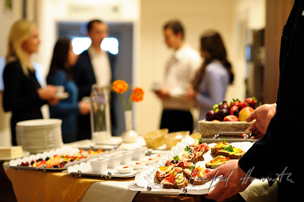 attendants of a seminar near the buffet