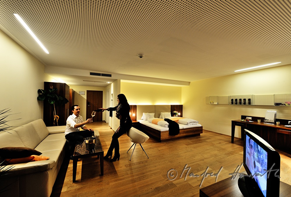 guests drink wine in their suite