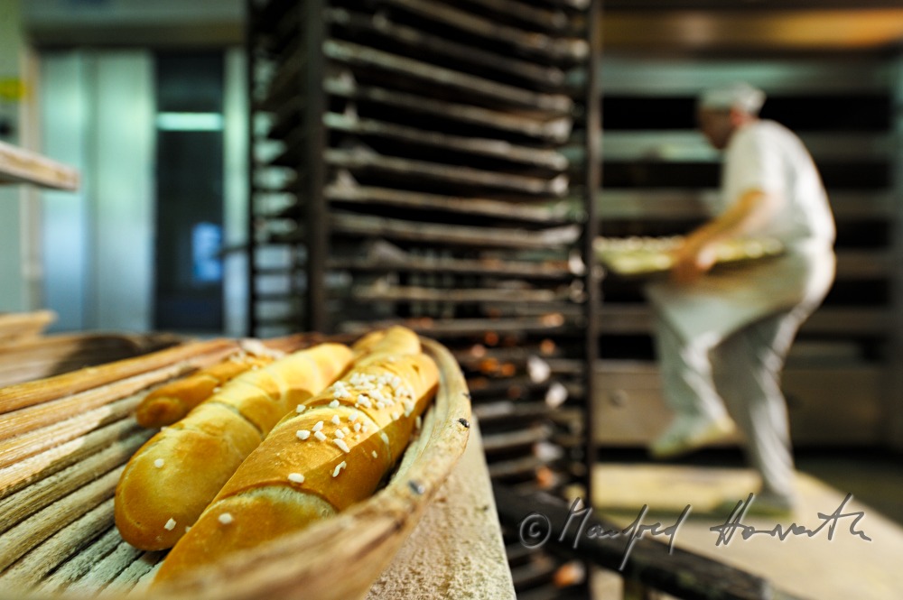 freshly baked sticks of pretzel near the baking oven