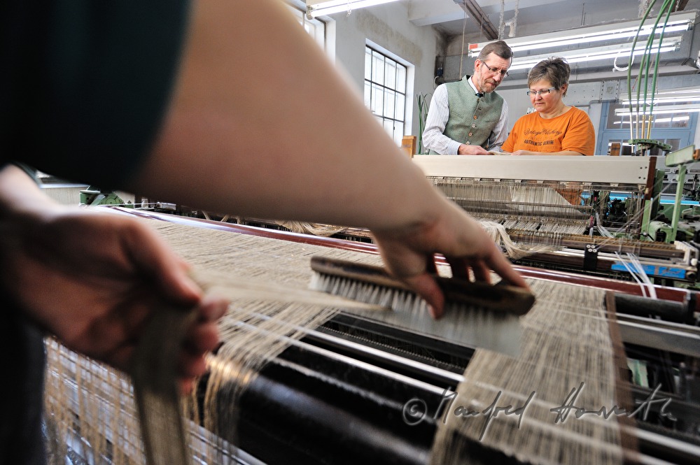 weaving of linen cloth on the mechanic loom