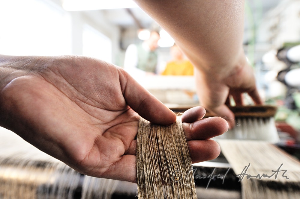weaving of linen cloth on the mechanic loom