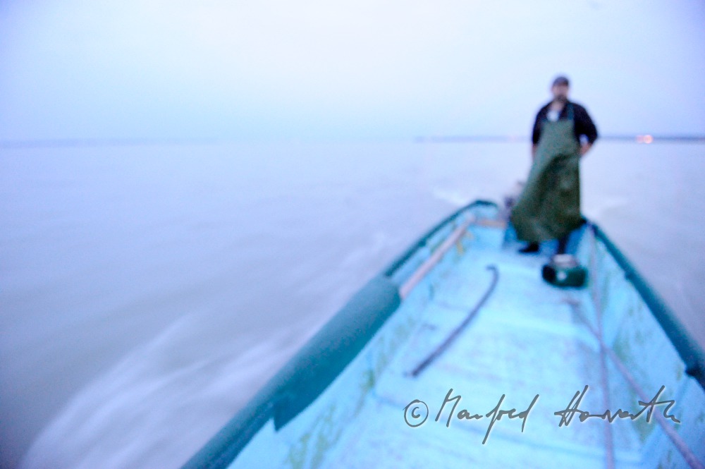 fisherman with boat on the way to work