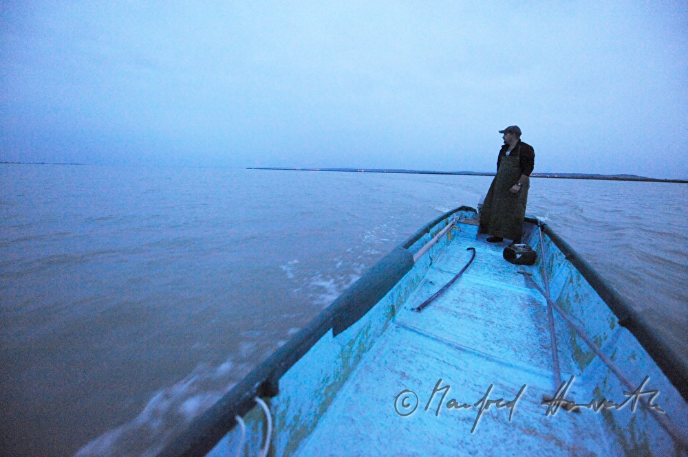 fisherman with boat on the way to work