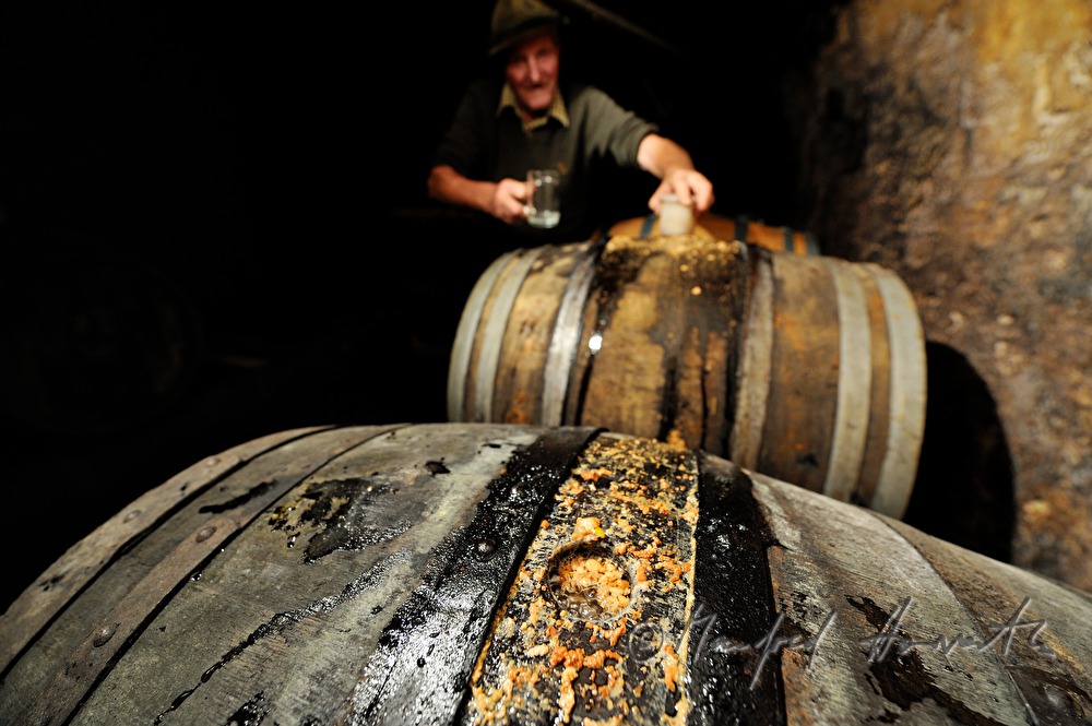 must farmer with open must barrel