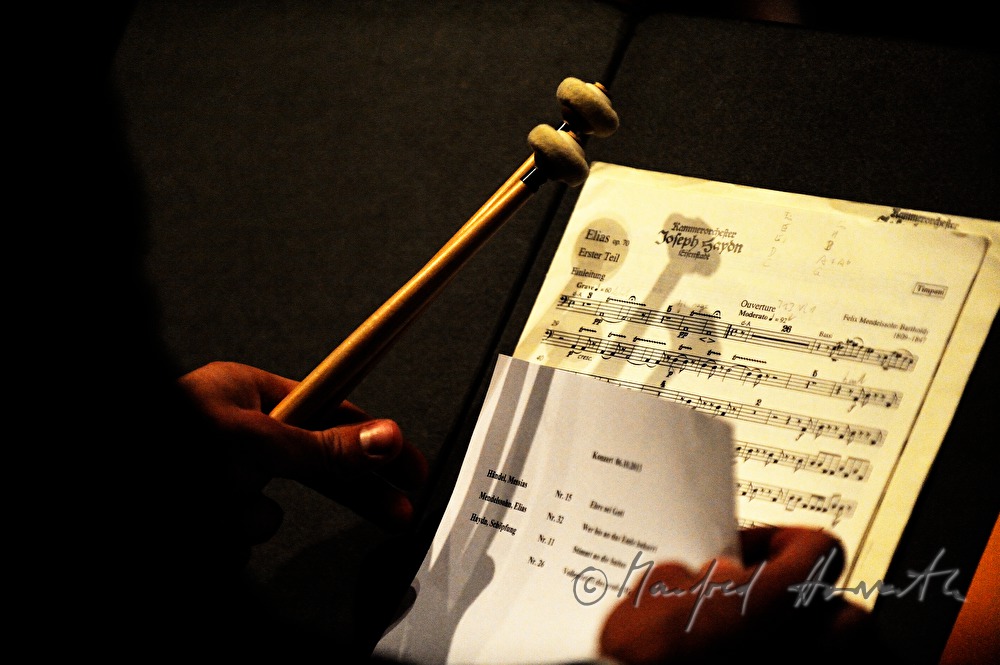 drummer of the Haydn Choir with drumsticks and notes