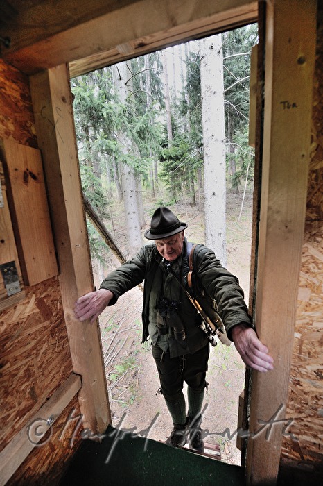 gamekeeper enters the deer stand