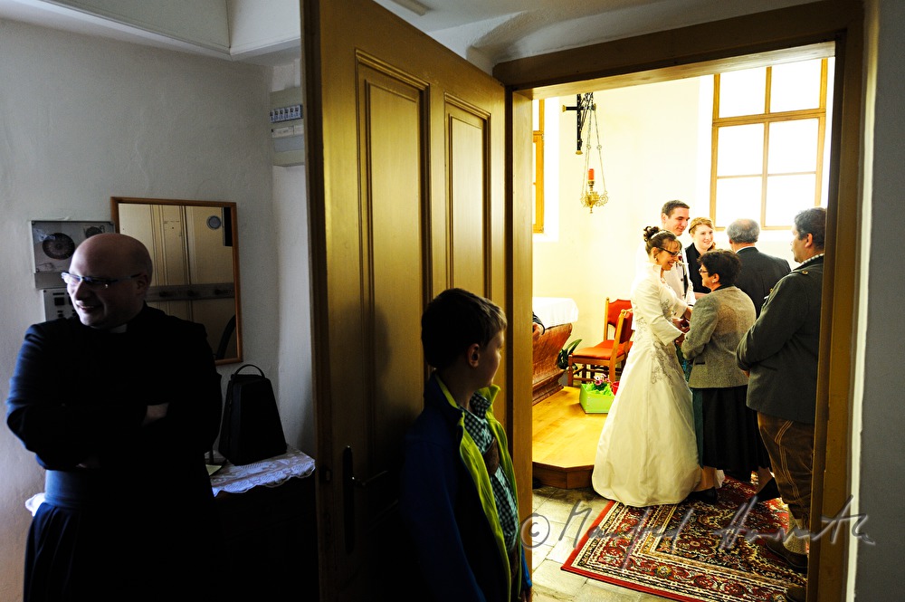 priest and acolyte in the vestry after the wedding ceremony