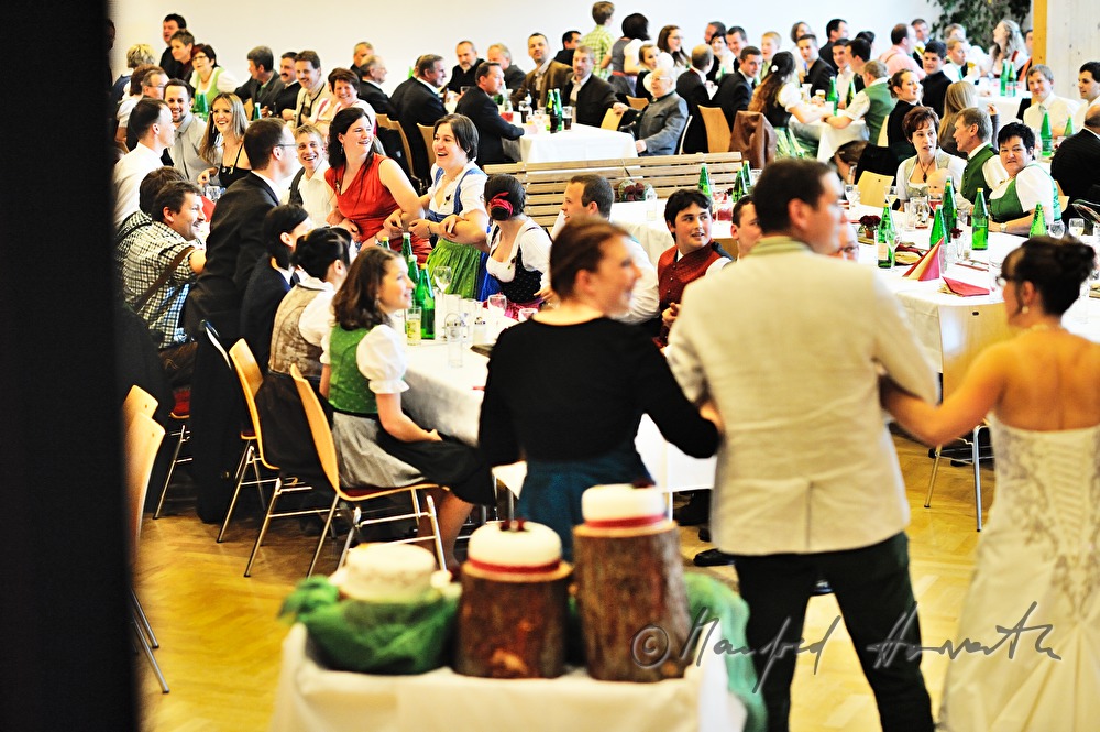 bridal couple and wedding guests swaying to the folk music
