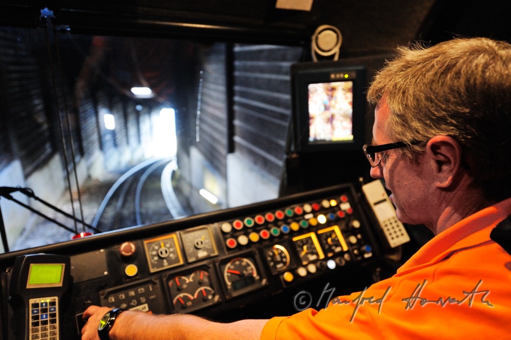 train driver of the cog railway in his cockpit