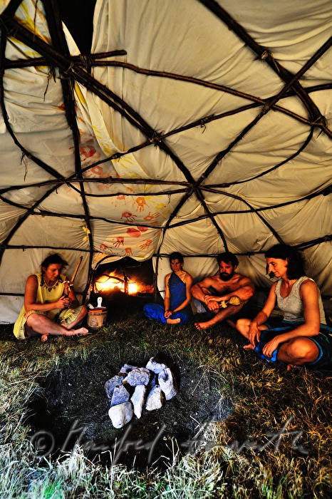 attendants of a shaman ritual pray and sing