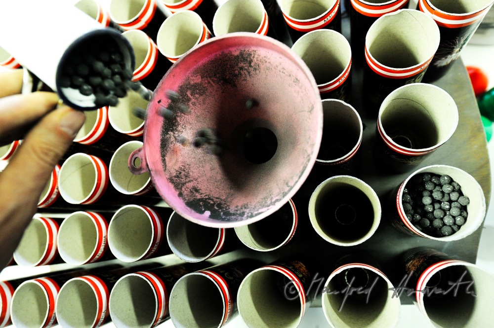filling the fireworks rockets with black powder