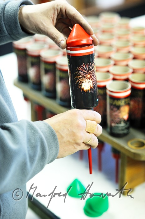 filling the fireworks rockets with black powder