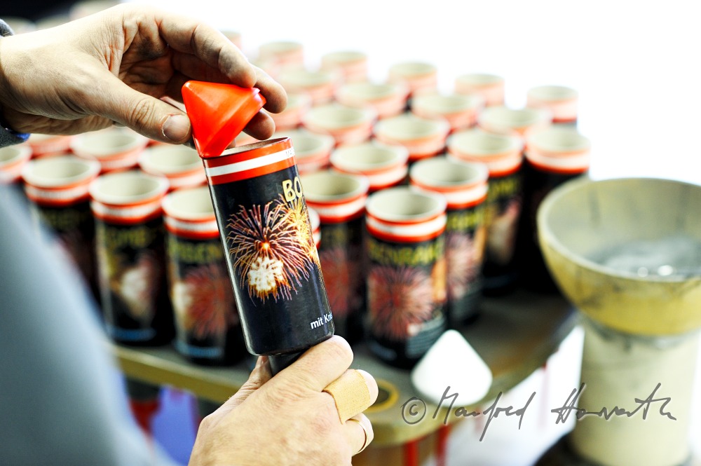 filling the fireworks rockets with black powder