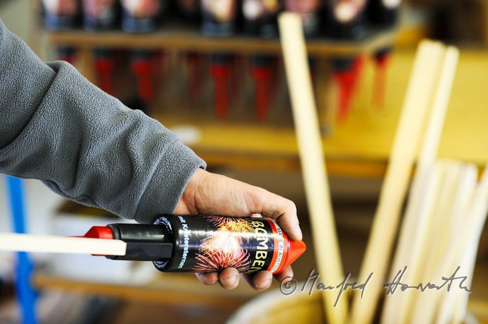 mounting the wooden poles on the rockets