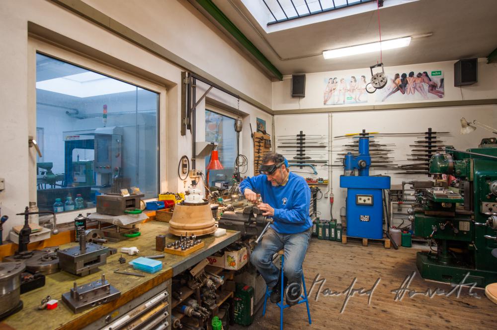 Erwin Perzy works on a snow man made of copper