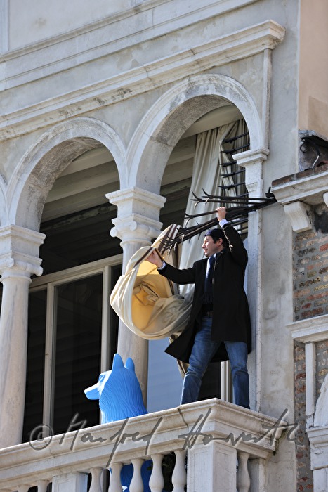 man dismounting a curtain of a palace