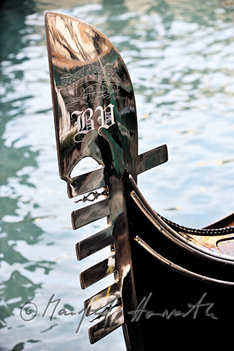 decorated blade on the bow of a gondola