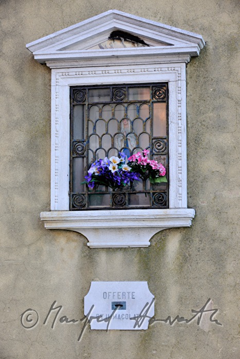 offering box on the wall of a church