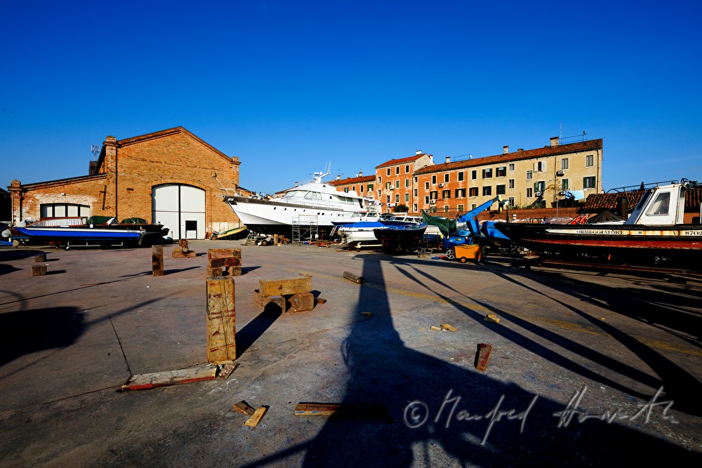 boats in front of a shipyard