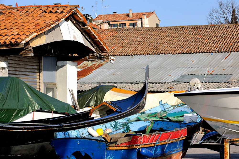 boats in front of a shipyard
