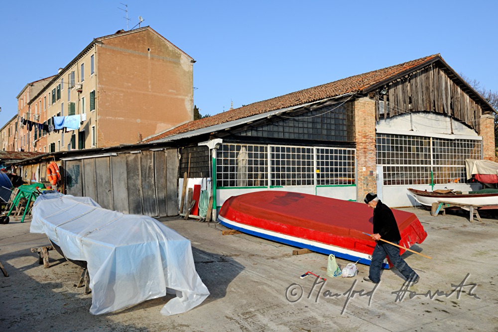 boats in front of a shipyard