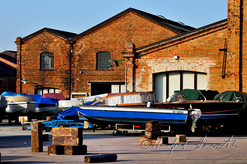 boats in front of a shipyard