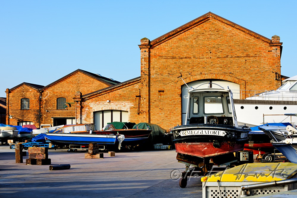 boats in front of a shipyard