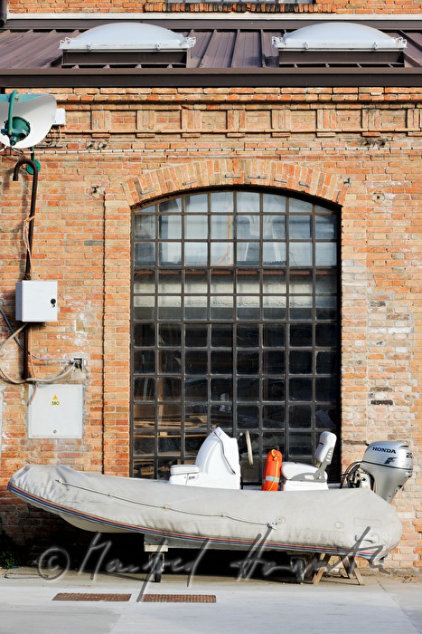 rubber raft in front of a brick building