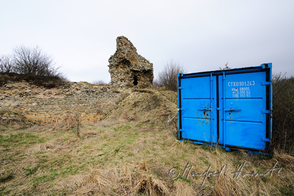 castle ruins and container