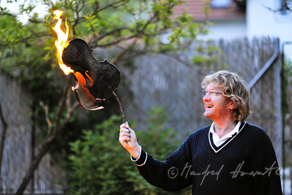 violinist with burning violin