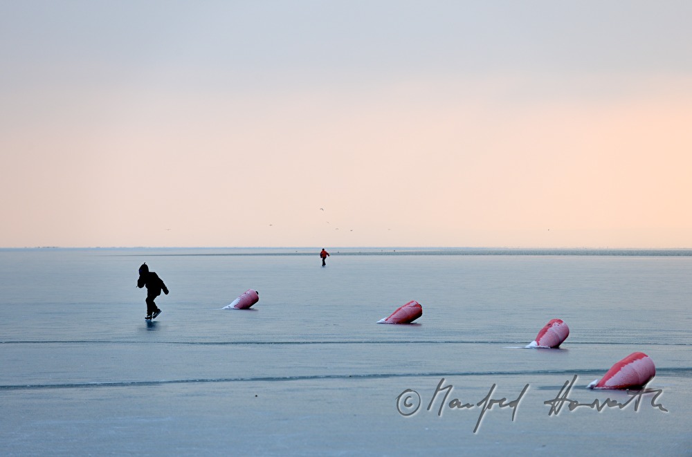 icebound buoys and ice skaters