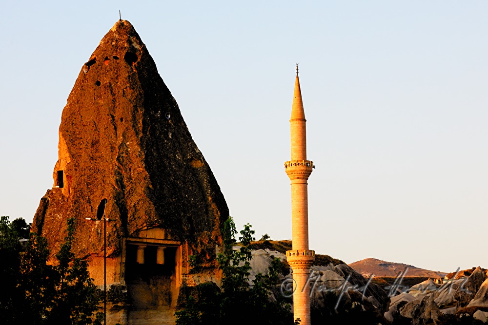 rock church Roma Kalesi and a minaret