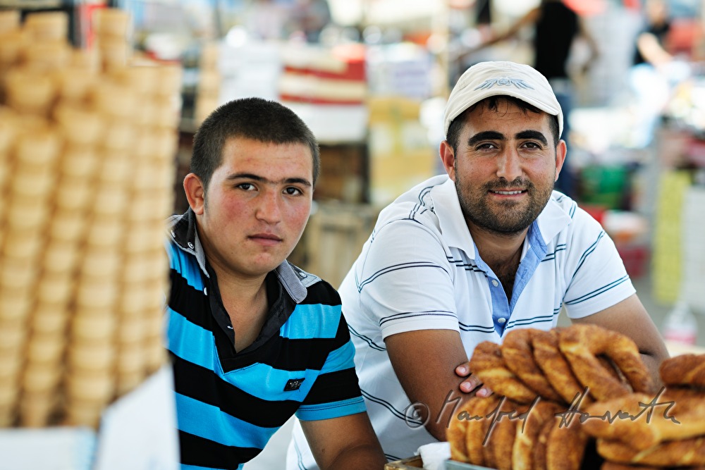 vendor men in their stand sell bread