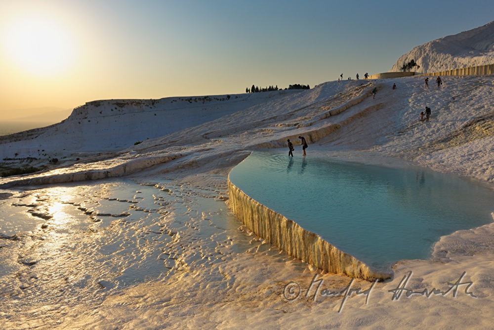 Calcareous sinter pool and tourists