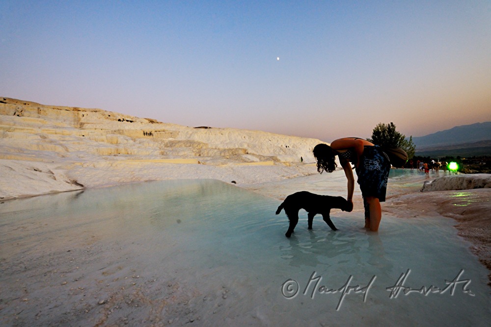 Calcareous sinter pool and tourists
