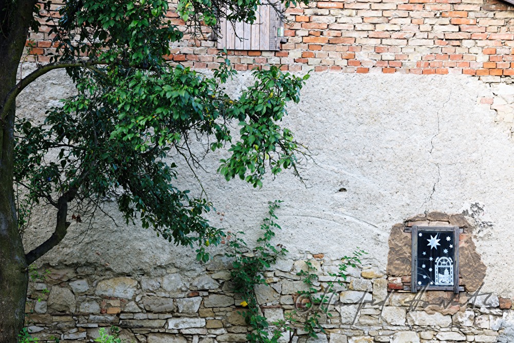 modern Madonna in a niche of a farm house
