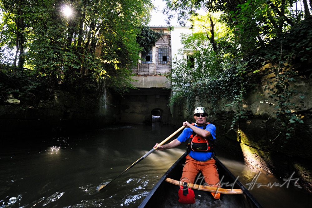 kajaker near a small  floodgate