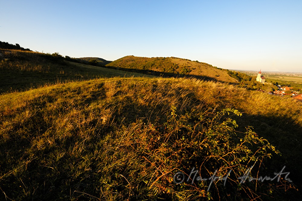 celtic burial mounds on the hill over the village