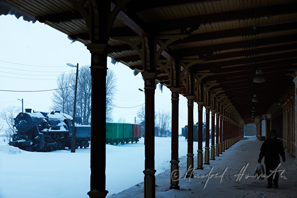 travellers on the platform of the train station