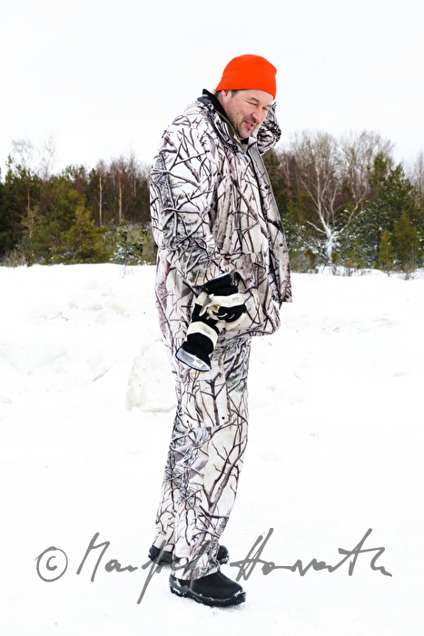 gamekeeper in his winter camouflage suit