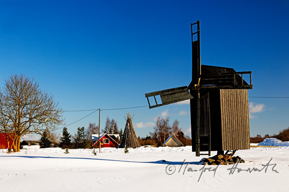 wind mill (post mill) and a typical house