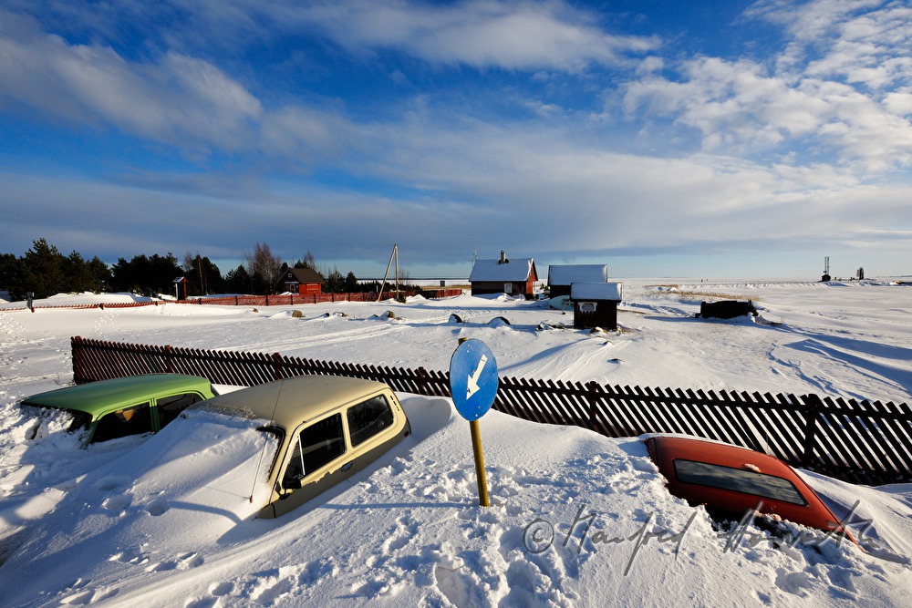 snowed under car and boat houses