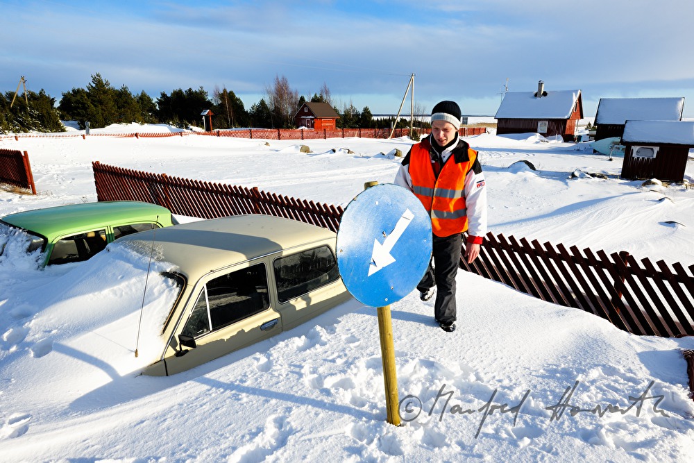snowed under car and boat houses