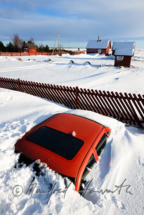 snowed under car and boat houses